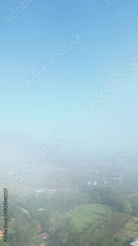 vdo drone move at Aerial View of Doi Luang Chiang Dao Mountain with Rural Landscape and Sun Rays, Chiang Mai Thailand