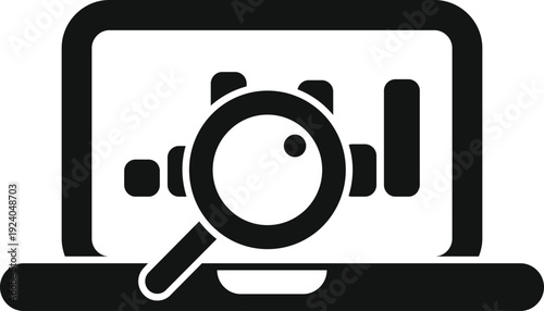 Laptop with bar chart on screen, a magnifying glass emphasizing data research