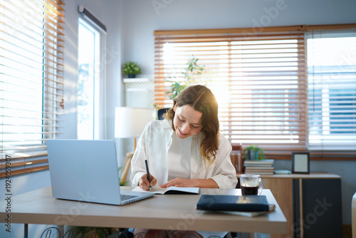Fotografía woman in home office, documents and laptop for research in remote work, ideas and thinking
