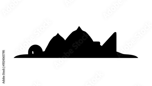 Silhouette of mountain range with small building