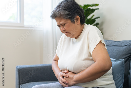 Free Download Sick asian senior woman in pain, hand holding belly, stomach pain from food poisoning, older hurt abdomen ache and digestive problem, gastritis or diarrhea. Health care inflammation, abdominal problem - GFXLoad