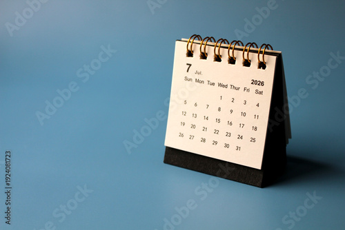 Monthly calendar template for the new year 2026 desk calendar,isolated on blue background.