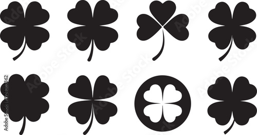 Various black silhouette shamrock and four leaf clover shapes on a clean white background