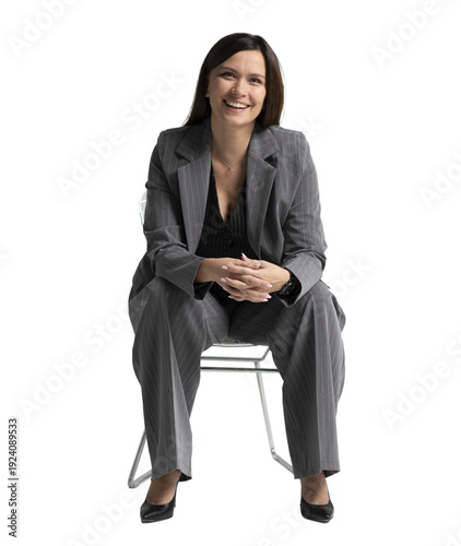 Portrait of a cheerful young businesswoman sitting in a chair against transparent background. Full body