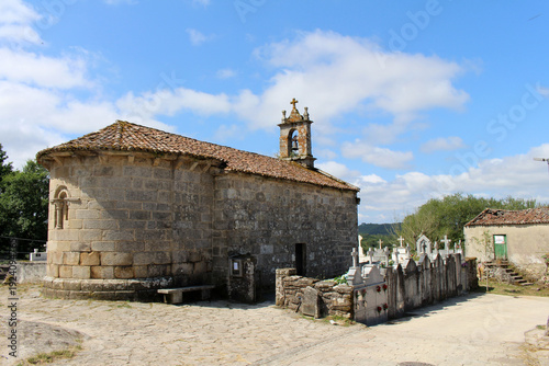 Iglesia de San Xiao do Camino and cross on the road in O Coton Palas de Rei July 2024