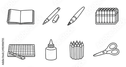 Notebook pens and craft supplies arranged on dark background