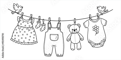 Black and white line drawing of baby clothes and a teddy bear hanging on a clothesline with birds infant clothing