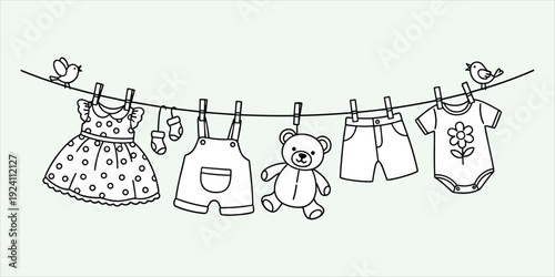 Children's clothes and teddy bear hanging on a clothesline with birds Keywords: children, clothes, baby, teddy bear, hanging