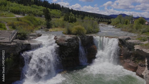 Wallpaper Mural Lundbreck Falls cascading over a rocky riverbed in Crowsnest River in slow motion in Alberta, Canada Torontodigital.ca