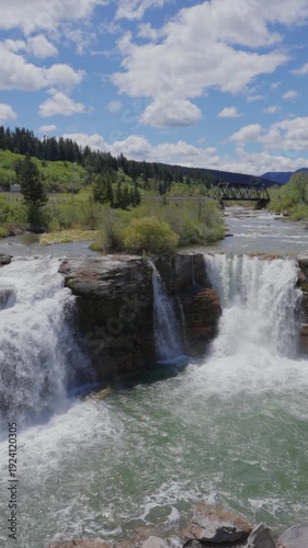 Wallpaper Mural Lundbreck Falls cascading over a rocky riverbed in Crowsnest River in slow motion in Alberta, Canada Torontodigital.ca