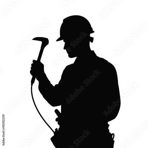 Silhouette of a construction worker holding a jackhammer in profile
