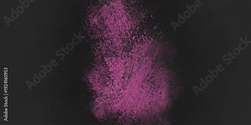 Pink powder explosion on black background. Abstract Pink and Black Spray Paint Texture Background. Colored cloud. Colorful dust explode. Paint Holi. 
