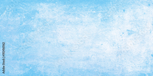 Light blue abstract grunge textured background with rough scratches and stains on surface