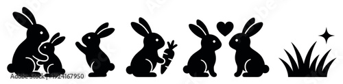 Black rabbit silhouette icon set showing various cute poses including a mother and baby, a bunny with a carrot, and a couple in love with a heart symbol