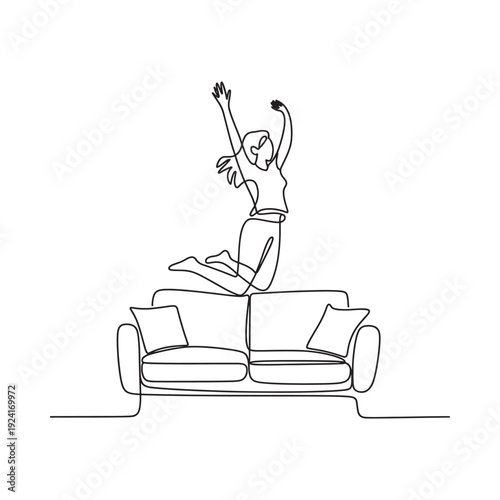 A joyful woman leaping in the air above a minimalist sofa