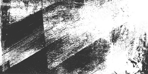 Grungy textured background with distressed black and white abstract brush strokes and speckles grunge