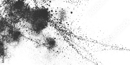Dark grey ink splatters and dust particles scattered across a white background paint spray