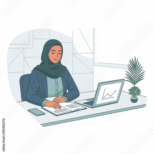 A woman in hijab working on laptop.