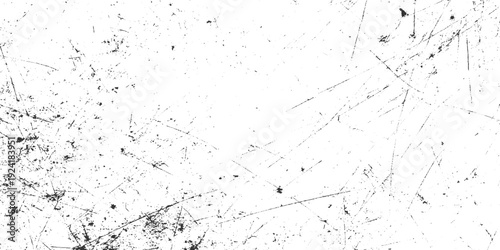Black and white abstract texture background with numerous fine scratches and speckles grunge