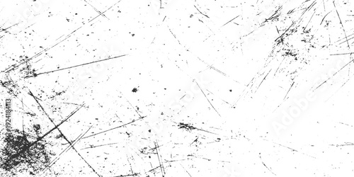 Black and white textured background with numerous fine scratches and speckles abstract grunge