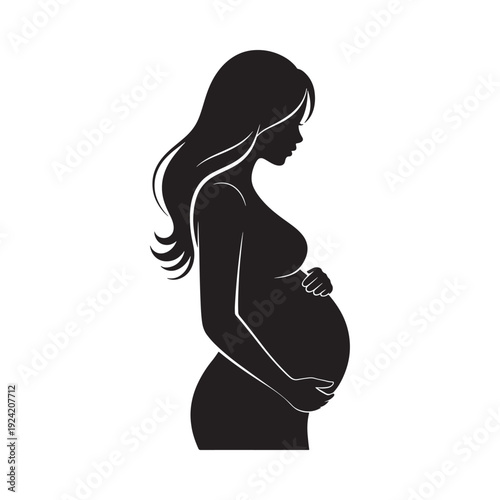 Silhouette of a pregnant woman in profile gently cradling her baby bump