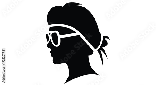 Silhouette of a woman in profile wearing sunglasses and a headscarf