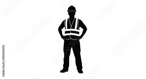 Silhouette of a construction worker standing with hands on hips