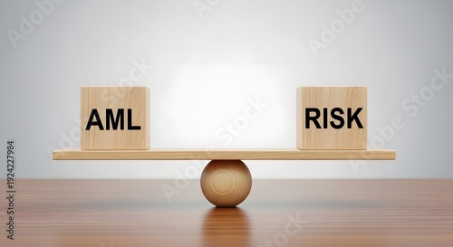 A wooden seesaw balancing aml and risk on a table with a grey background