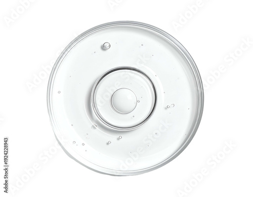 Clear liquid with ripples and bubbles in a petri dish