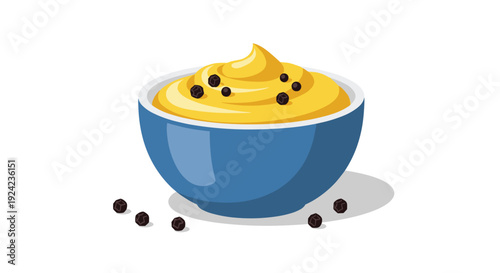 A blue ceramic bowl filled with swirled yellow sauce and topped with black peppercorns is set on a white background.