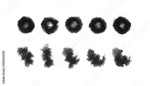Black ink splatters and blots on white background.