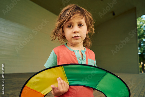 Young child holding kite