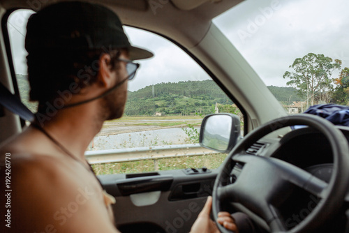 Wallpaper Mural Person driving shirtless inside a van on a countryside road Torontodigital.ca