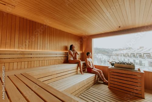 Couple relaxes in a wooden ...