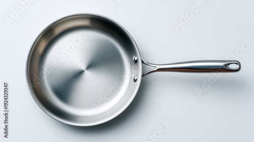 Stainless steel frying pan top view isolated on white background