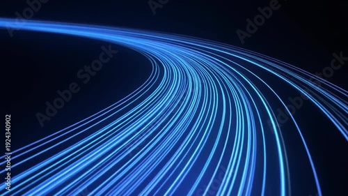 Abstract blue light trails curving into darkness motion blur background.