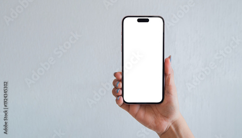 Female hand displaying smartphone mockup with transparent screen isolated on light background