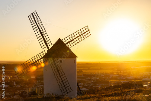Traditional Spanish windmill on La Mancha at sunset