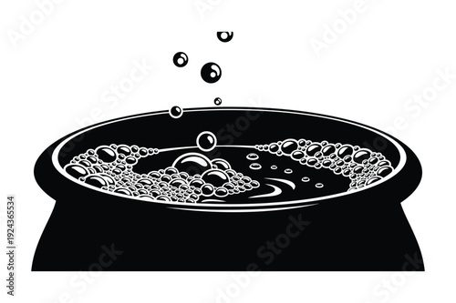 Bubbling cauldron with steam, witch's potion concept