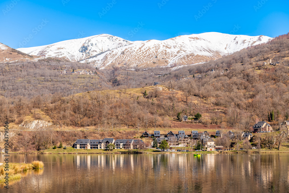 Fototapeta premium The shores of Lake Génos Loudenvielle, in the Hautes-Pyrénées, Occitanie, France