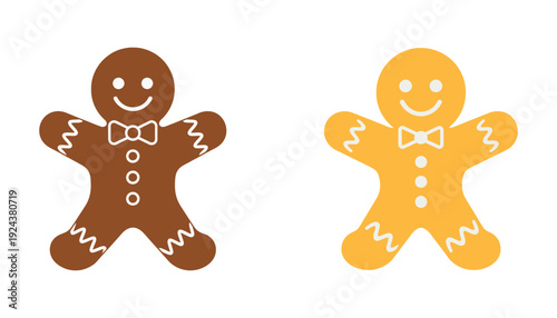 Two gingerbread men with icing decorations on white background