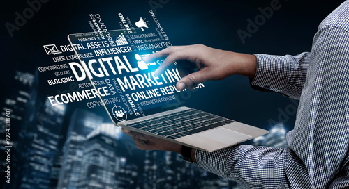 Φωτογραφία This image showcases a hand interacting with a laptop, surrounded by various terms related to digital marketing