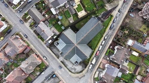High‑angle view of Birkenhead Christ Church surrounded by suburban streets and greenery.
