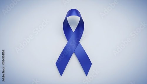 Blue awareness ribbon symbolizing support and hope on light background