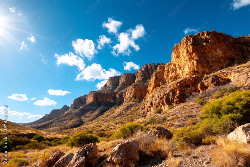 Fototapeta premium Rugged Desert Landscape with Dramatic Cliffs under Clear Blue Sky
