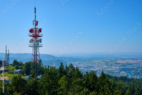 Beautiful alpine panorama with a mobile network base station and a panoramic view of Gmunden, Austria.