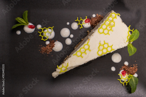 A slice of cottage cheese pie on a plate with beautiful decoration