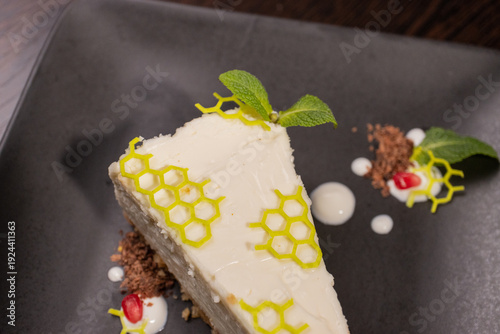 A slice of cottage cheese pie on a plate with beautiful decoration