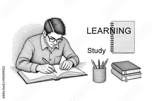 Young student wearing glasses diligently writing in an open book with study materials nearby