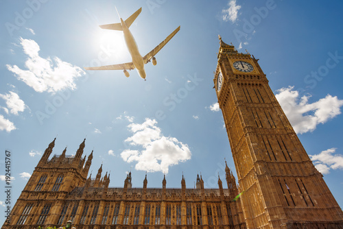 Photography Airplane fly over Big Ben in London under sun, United Kingdom